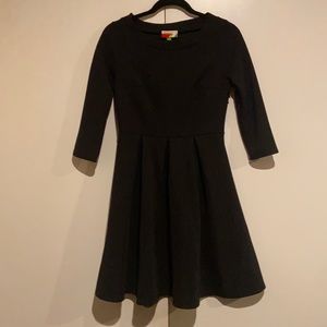 Long sleeved black A-line dress